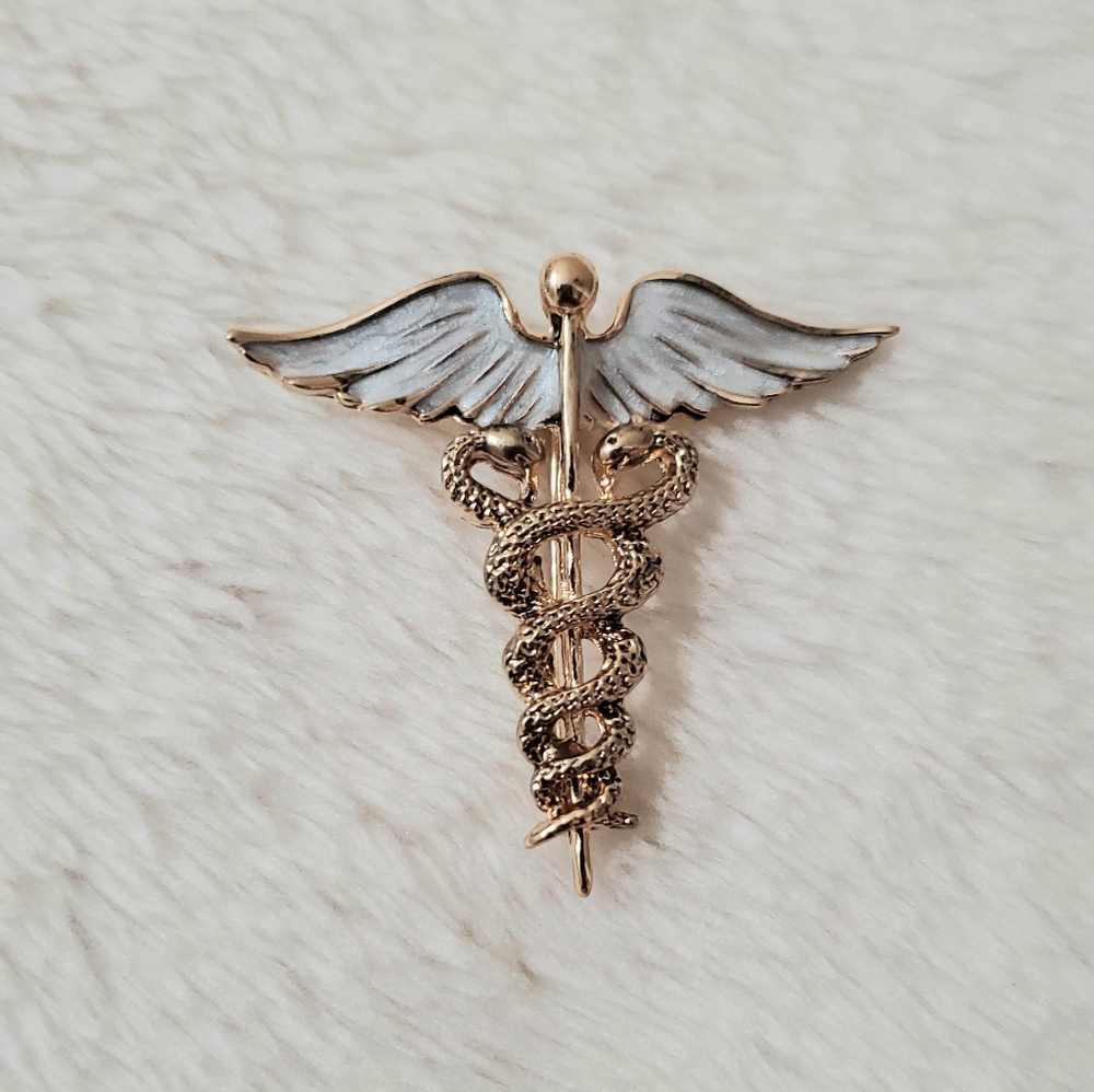 Brooch - universal medical symbol